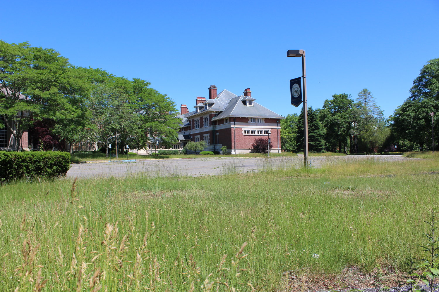 The Vanderbilt estate and other buildings on the 25-acre former Dowling College campus are still empty; grass is not mowed and residents report vandalism, fires and graffiti.